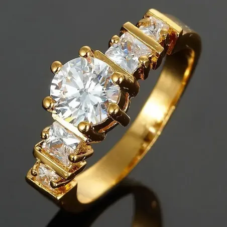 Anillo plateado con una piedra central grande y facetada rodeada de pequeños cristales.
