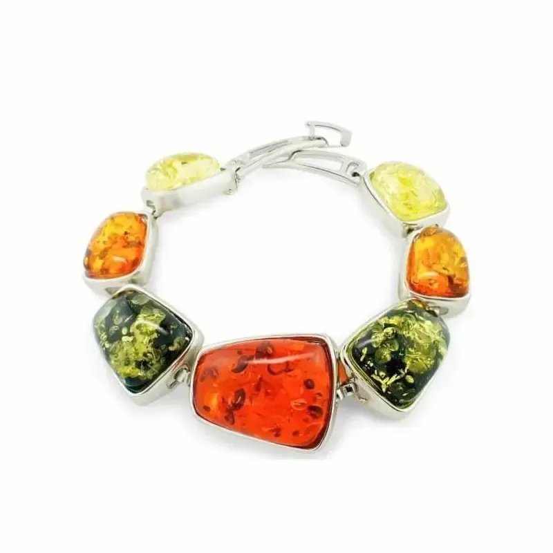 Pulsera de ámbar multicolor con cuentas en tonos cálidos sobre fondo neutro.
