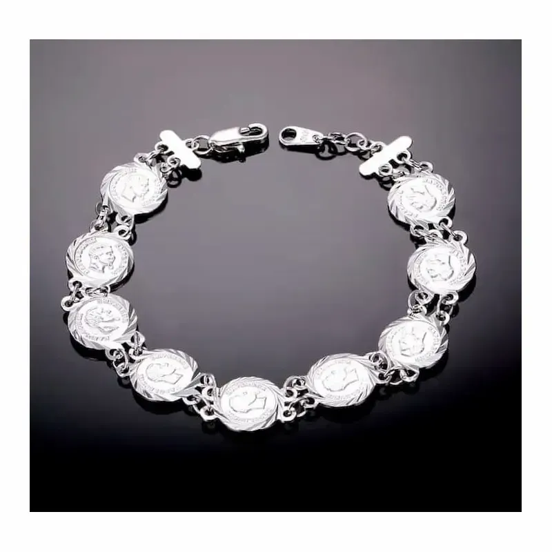 Pulsera de mujer con monedas francesas de plata envejecida y cobre rosado.