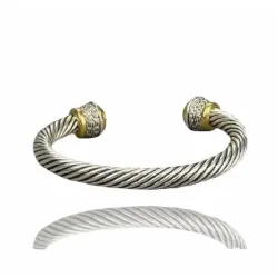 Pulsera media luna chapada en plata con detalles dorados