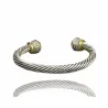 Pulsera media luna chapada en plata con detalles dorados