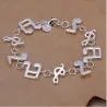 Brazalete musical de acero chapado en plata con diseño inspirado en notas musicales.