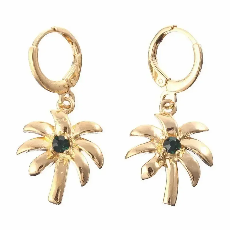 Pendientes bisutería mujer con hojas palmera 1,5cm oro 14K y cristal negro, sobre fondo rosa suave.