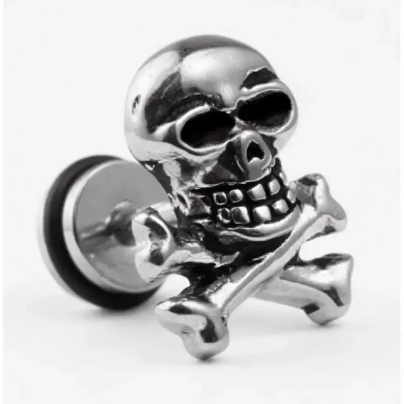 Pendiente bisutería hombre con calavera mexicana acero inoxidable y relieve detallado, sobre fondo negro.