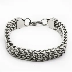 Pulsera de acero inoxidable de eslabones anchos, acabado pulido y cierre de presión.