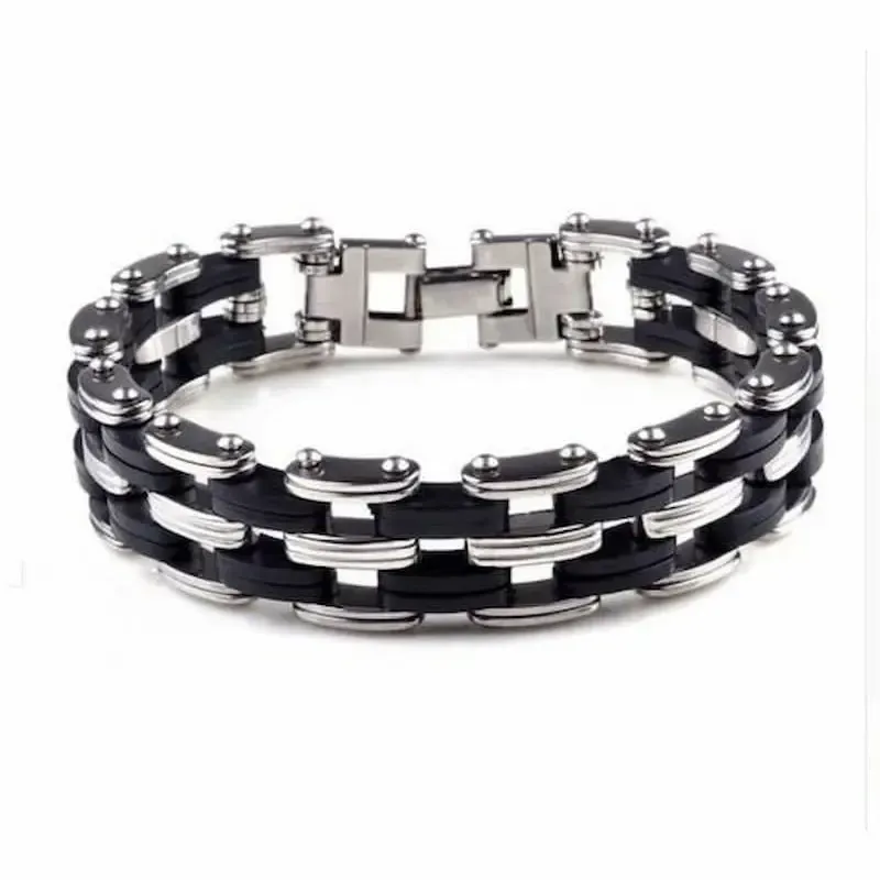 Pulsera bisutería hombre con diseño bicicleta 1,5cm acero y silicona negra, sobre fondo gris claro.