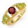 Anillo de plata esterlina 925 con piedras rojas (granate) y verdes (peridoto) incrustadas, acabado brillante.