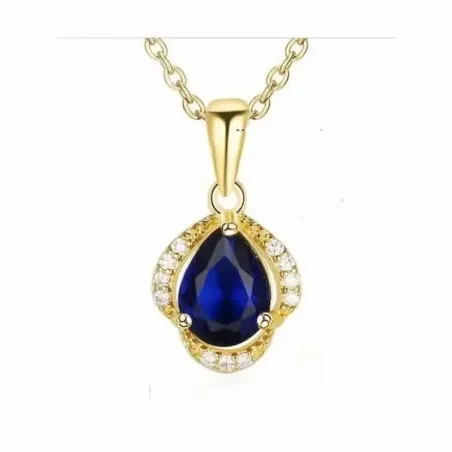 Colgante de cristal azul brillante con pequeños destellos en una cadena dorada fina.