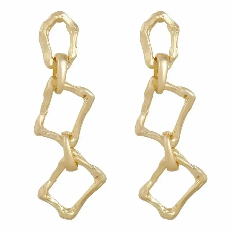 Pendientes geométricos dorados largos. Acero 18k. 5,2gr